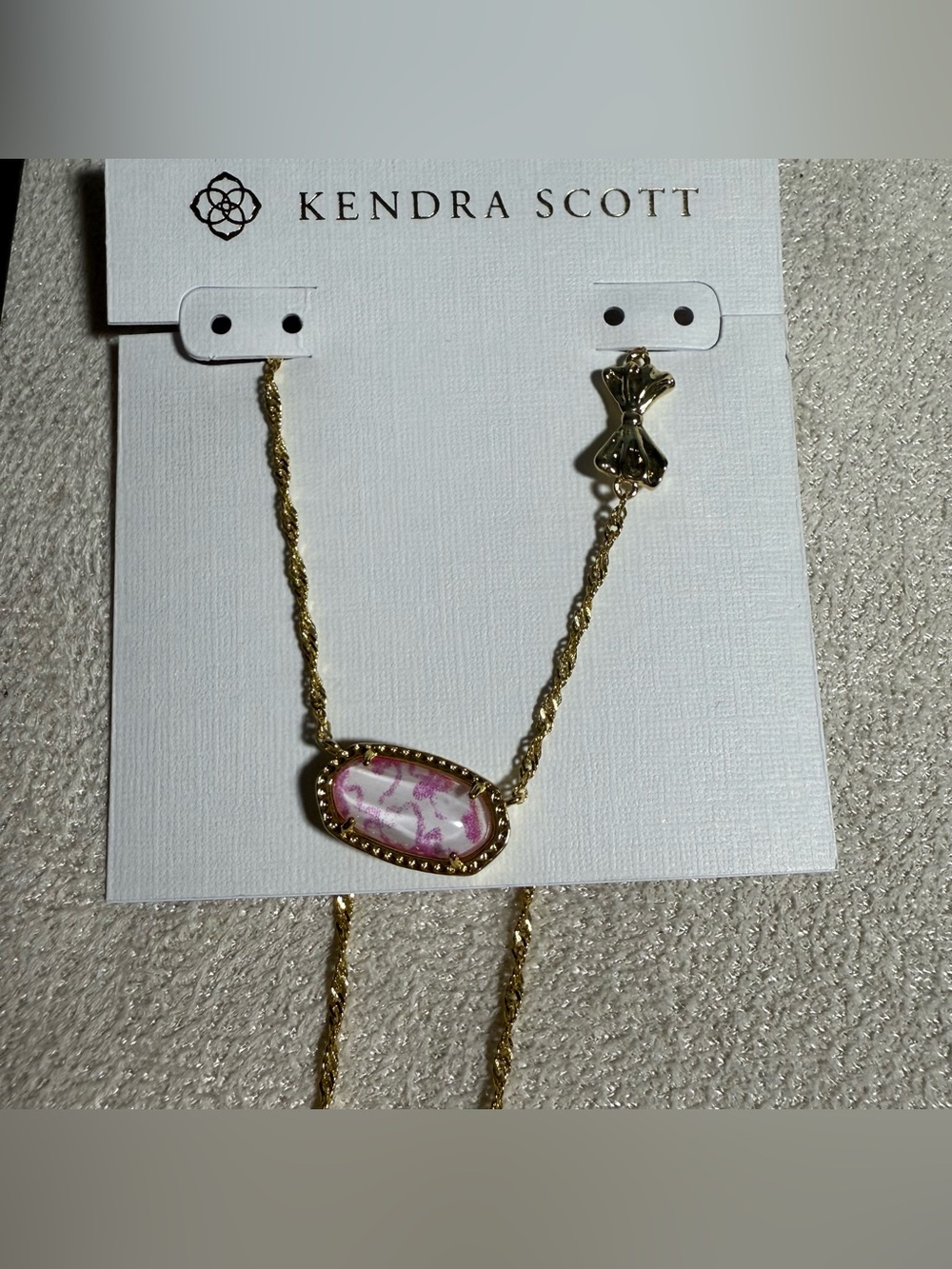Kendra Scott Gold Necklace with Light Pink Oval Pendant and Logo Charm